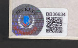 A Beckett authentication sticker (BB36634) with QR code and hologram is affixed to the Jason Alexander Signed Framed 8x10 Seinfeld Photo by Sports Integrity.