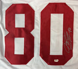 The Jeremy Shockey New York Signed White Football Jersey by Sports Integrity features large red numbers 80 on mesh with a silver autograph on the 0 and a small metallic sticker below the numbers.