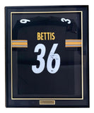 The Sports Integrity Jerome Bettis Pittsburgh Signed Framed Black Football Jersey (BAS) features yellow and white stripes, the name Bettis, number 36, and a plaque with "Jerome Bettis" at the bottom.