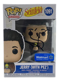 Jerry Seinfeld Signed Seinfeld Funko Pop #1091 by Sports Integrity, featuring Jerry with a Pez dispenser, Walmart exclusive box with Seinfeld logo, and black autograph on the window. JSA+PSA authenticated.