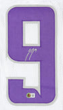 The JJ McCarthy Minnesota Signed White Football Jersey by Sports Integrity features a large purple number 9 on white mesh, a white signature, and a round QR code sticker near the bottom.