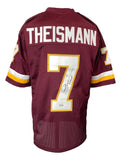 This Sports Integrity Joe Theismann Washington Signed Maroon Football Jersey features yellow and white accents, THEISMANN and number 7 on the back, signed in black marker with "MVP 83" inscription. BAS authenticated.