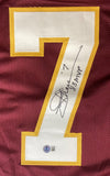 The Sports Integrity Joe Theismann Washington Signed Maroon Football Jersey features a large white and yellow number 7 with "MVP 83" and his signature in black, plus a BAS authentication sticker.