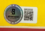 A Beckett authentication sticker with QR code and serial number BR00556 is attached to the Sports Integrity Joey Logano Signed Framed 8x10 NASCAR Photo, confirming it as a Beckett Verified Authentic Autograph.