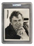 John Candy Signed 8x10 Photo PSA/DNA Auto Mint 9 Grade by Sports Integrity features a black and white close-up of a smiling John Candy in a jacket, autographed "Many thanks, John Candy," in a protective holder with certification.