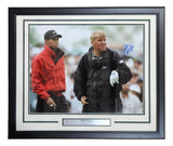 A framed 16x20 photo by Sports Integrity shows John Daly and Tiger Woods on the golf course, signed by Daly, with a plaque reading JOHN DALY.