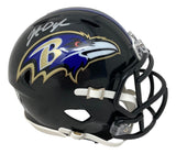 The Sports Integrity Johnathan Ogden Signed Baltimore Ravens Mini Speed Helmet features the team's logo and Ogden's autograph in silver on a black mini helmet.