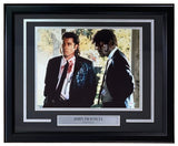 A John Travolta signed and framed 11x14 Pulp Fiction photo from Sports Integrity, authenticated by PSA/DNA, featuring two men in suits—one with blood on his shirt—as seen in the iconic film.