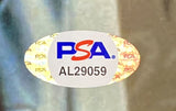 Oval PSA/DNA authentication sticker with a holographic background, showing the PSA logo in blue and red and serial number AL29059, included with the Sports Integrity John Travolta Signed Framed 11x14 Pulp Fiction Photo.