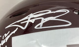 Close-up of a shiny maroon Johnny Manziel Signed Texas A&M Full Size Authentic Speed Helmet by Sports Integrity with large white autograph, "12" inscription, and reflective surface.