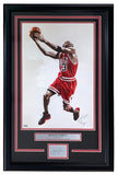The Sports Integrity Michael Jordan Framed 13x19 Bulls Litho features the basketball legend mid-air in his red jersey, signed by Tony Santiago with a laser auto and plaque beneath the image.