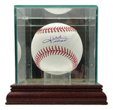 The Sports Integrity Juan Soto New York Mets Signed Official MLB Baseball is displayed inside a glass case with a wooden base, resting on a clear stand. The reflective case highlights the details of this collectible.