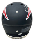 The Sports Integrity Julian Edelman Signed New England Patriots FS Black Authentic Speed Helmet (JSA) features red and white wing-like designs, a visible signature on top, “PATRIOTS” on the chin strap, and warning labels on the back.