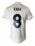 The Sports Integrity Kaka Signed Real Madrid White Adidas Soccer Jersey BAS features “KAKA” and number 8 on the back with an autograph on the number and a La Liga patch on the right sleeve.