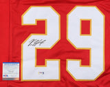 The Sports Integrity Kareem Hunt Kansas City Signed Red Football Jersey features the large white and yellow number 29 with a black autograph on the left digit, and includes a PSA/DNA certificate of authenticity card.