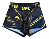 Kayla Harrison signed black UFC Venum fight trunks by Sports Integrity, featuring UFC and sponsor logos, with a white autograph on the right thigh. PSA/DNA authenticated.
