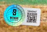 A holographic sticker with "B WITNESS AUTOGRAPH," a QR code, and number 1W449447 appears on a white label attached to the Sports Integrity Ken Griffey Jr. Signed Framed 16x20 Seattle Mariners Photo BAS ITP; background is earthy and blurred.