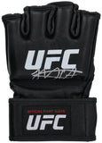 A black Khabib Nurmagomedov Signed UFC Fight Glove BAS by Sports Integrity features a white UFC logo, his silver autograph on the front, and "Official Fight Glove" in red and white on the wrist strap.