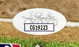 A Kyle Schwarber Signed 16x20 Philadelphia Phillies Blue Jersey Photo by Sports Integrity features a white JSA oval sticker with code CG19223, faint JSA letters, and a signature, set on grass and dirt.