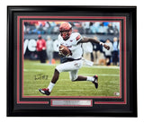 The Sports Integrity Lamar Jackson Signed Framed 16x20 Louisville Cardinals Photo BAS features him running with the ball in a white and red uniform, accompanied by a plaque noting his 2016 Heisman Trophy win.