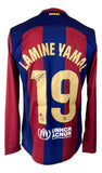 The Sports Integrity Lamine Yamal Signed Barcelona Nike Long Sleeve Soccer Jersey BAS features red and blue stripes, gold number 19 and name on the back, signature, and UNHCR logo near the bottom.