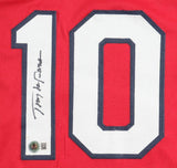 The Tony La Russa St. Louis Signed Red Baseball Jersey by Sports Integrity features a large white number 10 outlined in black, with a black signature on the left digit and a small circular QR code patch below it.