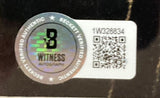 A Beckett Witness Authentication sticker with holographic seal, BECKETT VERIFIED AUTHENTIC text, QR code, and serial 1W328834 appears on the Sports Integrity Laurence Fishburne Signed Framed 11x14 John Wick Photo BAS.