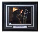 The Sports Integrity Laurence Fishburne Signed Framed 11x14 John Wick Photo (BAS) features his autograph and a metallic nameplate displaying his name and the movie title.