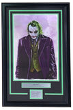 Sports Integrity’s Heath Ledger Framed 13x19 Joker Lithograph features the iconic green-haired, white-faced Joker in a purple suit, includes a plaque titled "The Joker," and comes with Tony Santiago's laser-signed autograph card.