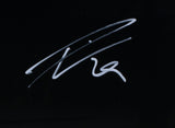 The Sports Integrity Leon Draisaitl Signed Framed Edmonton Oilers 11x14 Spotlight Photo features a stylized autograph on a black background and is Fanatics authenticated, perfect for true Edmonton Oilers fans.