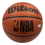 A Sports Integrity Luka Doncic Los Angeles Lakers signed NBA Wilson Forge basketball, with PSA/DNA authentication, features an orange textured surface and bold black lettering.