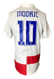 The Sports Integrity Luka Modric Signed Croatia Nike Soccer Jersey ICONS COA features a white jersey with a red checkered pattern, "Modrić" and number 10 in blue on the back, plus Modric’s signature below the number.