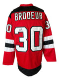 Sports Integrity Martin Brodeur New Jersey Signed Red Hockey Jersey JSA features black and white stripes, number 30, BRODEUR on the back, and a signature on the left side of the number.