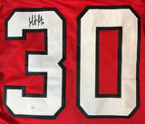 The Sports Integrity Martin Brodeur New Jersey Signed Red Hockey Jersey features a large white number 30 with black outline and an autograph above the upper left of the 3. Authenticated by JSA.