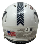 The Sports Integrity Terry McLaurin Signed Commanders Salute to Service Mini Speed Helmet BAS w/ Case features a white back view with chevron stripe, American flag sticker, camouflage pattern, and "SALUTE TO SERVICE" on the black bottom bumper.