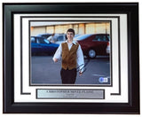 Christopher Mintz-Plasse Signed Framed 8x10 Superbad McLovin Photo by Sports Integrity, featuring him as McLovin smiling and walking in a parking lot, includes a nameplate and quote “I am McLovin.”.