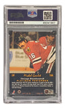 A Michel Goulet Signed 1992 Pro Set #166 Chicago Blackhawks hockey card by Sports Integrity, graded and PSA/DNA authenticated. Goulet is shown in a red jersey and helmet, with career highlights on the card.