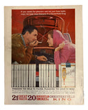 A man and woman smile at each other while leaning over the open trunk of a car. In front is the Mickey Mantle New York Yankees Signed 1962 Sports Magazine by Sports Integrity, promoted as a prized collector’s item.