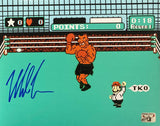 The Sports Integrity Mike Tyson Signed 8x10 Punch-Out photo features a retro 8-bit scene with a celebrating boxer, TKO referee, and Tyson's blue autograph on the left. Includes official Tyson hologram for authenticity.