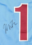 The Miles Teller Philadelphia Signed Light Blue Baseball Jersey by Sports Integrity features a large red and white number 1 on light blue fabric, with a black autograph overlapping the left side of the number.
