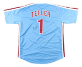 The Sports Integrity Miles Teller Philadelphia Signed Light Blue Baseball Jersey (BAS BT57636) features red and white trim, TELLER and number 1 on the back in white with a red outline, plus an autograph below the number.