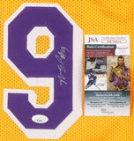 A Nick Van Exel Los Angeles yellow basketball jersey, signed in silver with a purple and white number 9 patch, is shown with a JSA basic certification card. Brand: Sports Integrity.