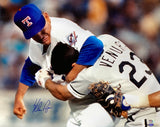 The Nolan Ryan Signed 16x20 Texas Rangers Ventura Fight Photo by Sports Integrity captures the iconic moment when Ryan puts Ventura in a headlock during their intense on-field altercation. PSA/DNA authenticated.