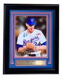 The Sports Integrity Nolan Ryan Signed Framed 8x10 Texas Rangers Bloody Lip Photo (PSA/DNA) features #34 with blood on his jersey, blue marker signature, and a plaque honoring his Hall of Fame 1999 induction.