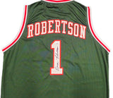The Sports Integrity Oscar Robertson Milwaukee Signed Green Basketball Jersey features red and white trim, the name ROBERTSON and number 1, and includes a JSA-authenticated signature.