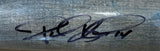 A close-up of a Paul Konerko White Sox Signed Game Used Cracked Old Hickory Baseball Bat by Sports Integrity, featuring a bold black autograph in looping script with visible wood grain.