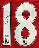 This Paul Scholes Signed Manchester United Nike Soccer Jersey by Sports Integrity features a red design with a large white number 18, each digit showing a black Premier League lion logo, an autograph on the left digit, and an authenticity sticker.