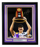 The Sports Integrity Paul Skenes Signed Framed 16x20 LSU Tigers Photo features a smiling athlete with NCAA trophy, signature on the upper right, and a plaque reading PAUL SKENES LSU Tigers 2023. Black frame with purple and gold accents; MLB hologram included.