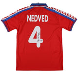 The Sports Integrity Pavel Nedved Signed Czech Republic Puma Soccer Jersey (BAS) features NEDVED and number 4 on the back, with a signature below the number. The red jersey includes blue and white trim.