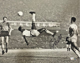 The Sports Integrity Pele Signed 16x20 Soccer Bicycle Kick Photo Fanatics features Pelé performing a mid-air bicycle kick, with three players watching and a stadium crowd in the background. The image is hand-signed by Pelé.